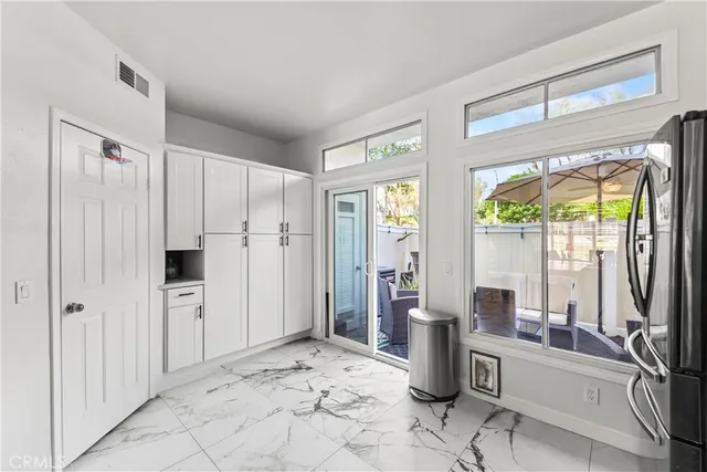 a view of a storage & utility room with windows