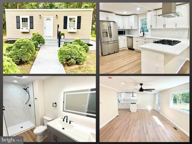 a view of kitchen with stainless steel appliances kitchen island granite countertop a refrigerator and microwave