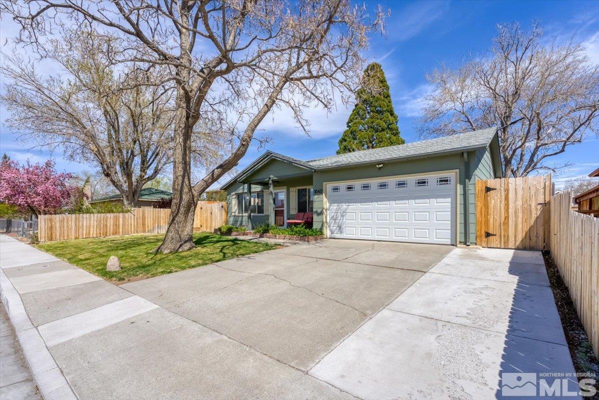 1640 Emerald Place Reno, NV 89502 - Photo 1 of 25 a view of entrance gate of house and trees