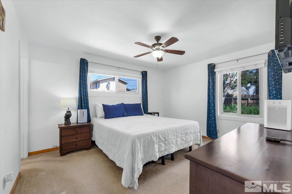 1640 Emerald Place Reno, NV 89502 - Photo 13 of 25 a bedroom with a bed and window
