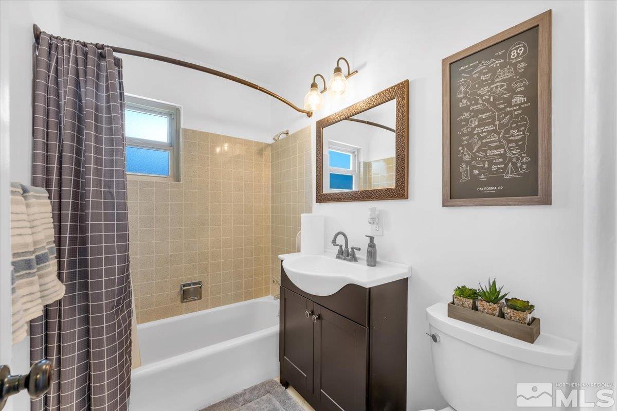 1640 Emerald Place Reno, NV 89502 - Photo 18 of 25 a bathroom with a sink mirror and bathtub