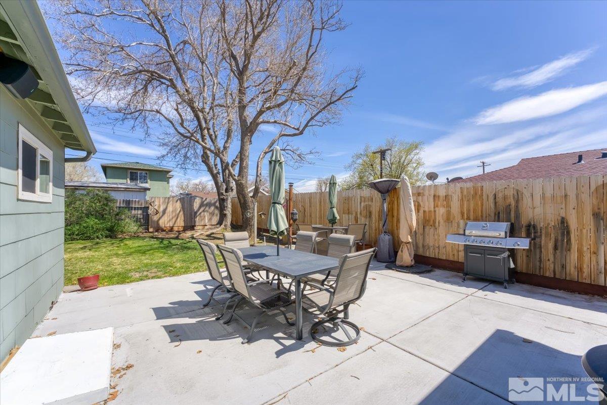 1640 Emerald Place Reno, NV 89502 - Photo 20 of 25 a view of a patio with a table chairs and a yard