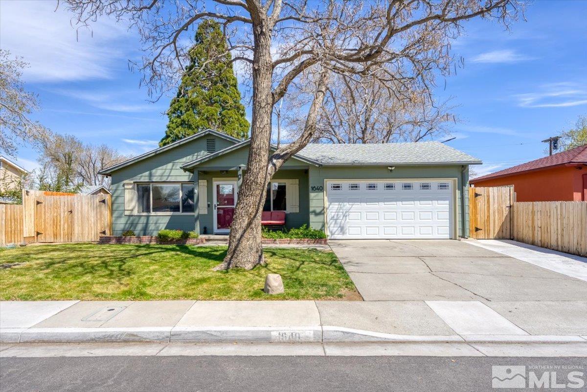 1640 Emerald Place Reno, NV 89502 - Photo 3 of 25 a view of a house with a small yard plants and a large tree