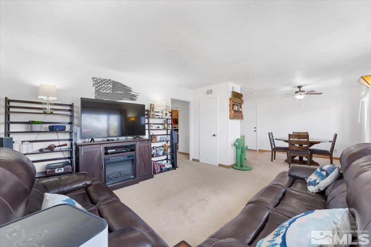 1640 Emerald Place Reno, NV 89502 - Photo 5 of 25 a living room with furniture and a flat screen tv