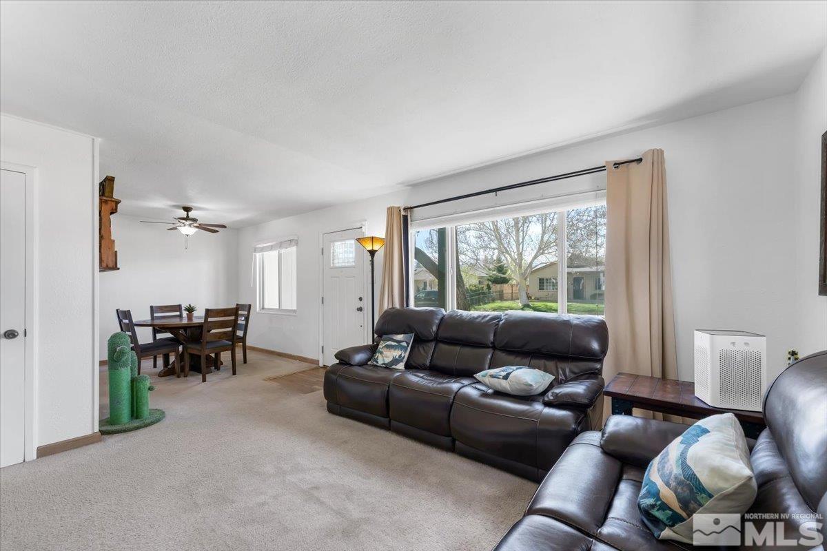 1640 Emerald Place Reno, NV 89502 - Photo 6 of 25 a living room with furniture and a large window