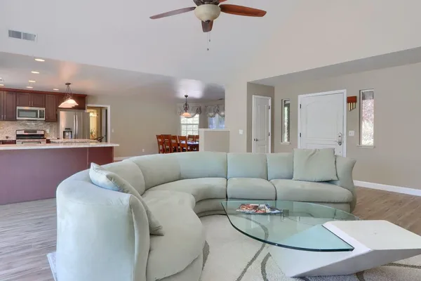a living room with furniture and a window