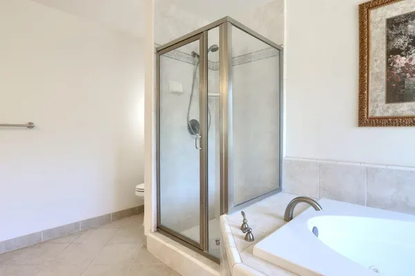 a bath tub sitting next to a window