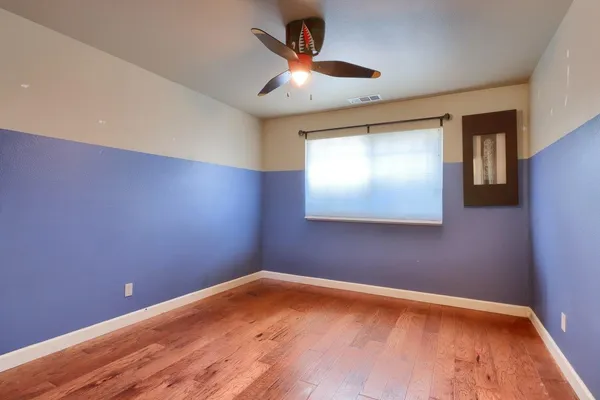 a bedroom with furniture and window