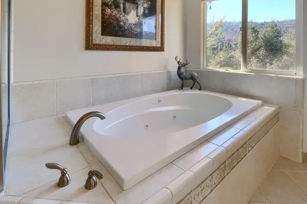 a bath tub sitting next to a window