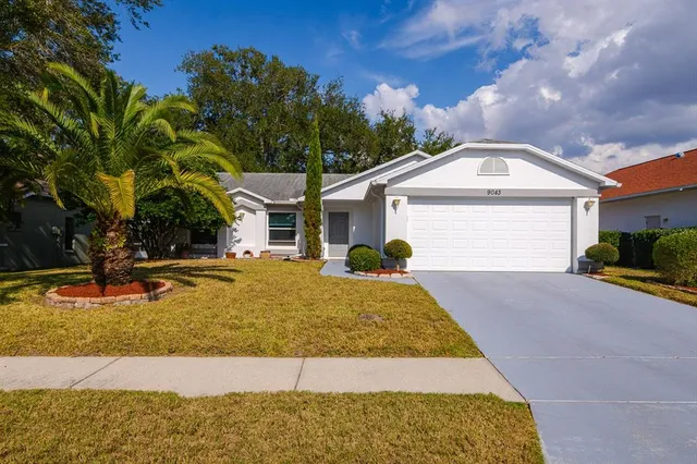 a front view of a house with swimming pool