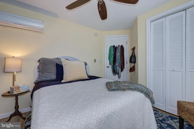 a bed room with a bed and a chair