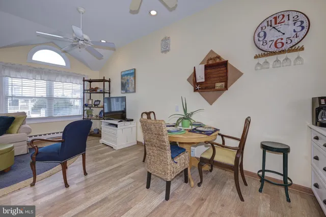 a dining room with furniture and window