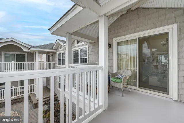 a view of a brick house with large windows