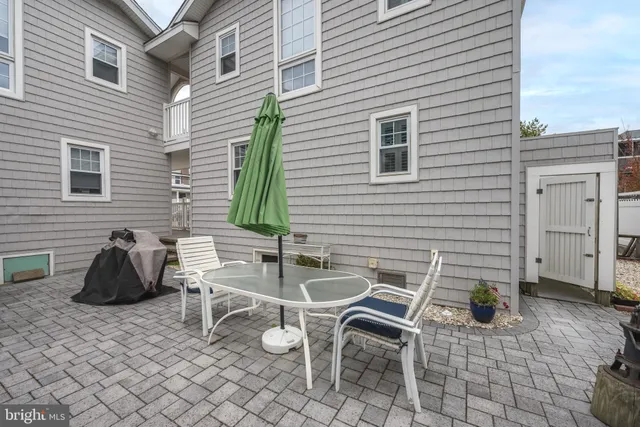 a view of a chairs and table in patio