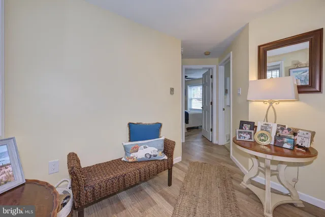 a living room with furniture and a lamp