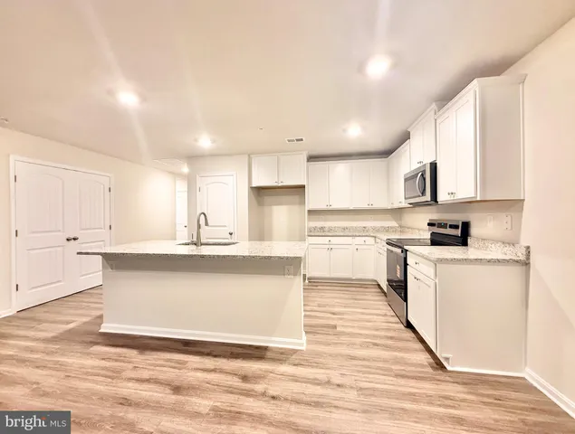 a large kitchen with cabinets