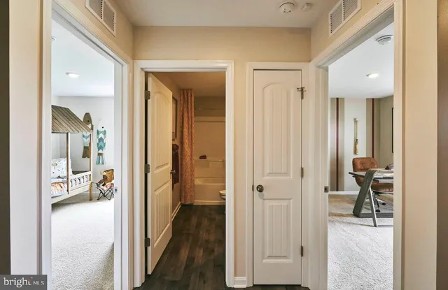 a view of a hallway with a livingroom and living room