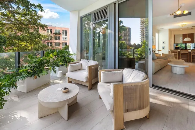 a outdoor living space with furniture and a potted plant
