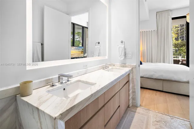 a bathroom with a sink double vanity and a mirror