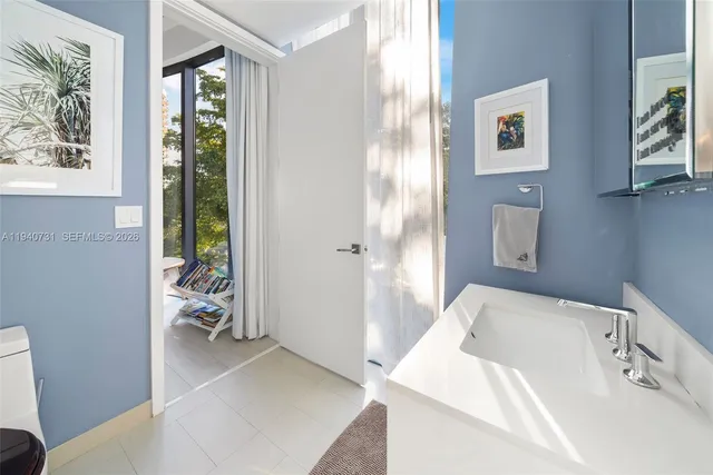 a en suite bathroom with a tub shower and window