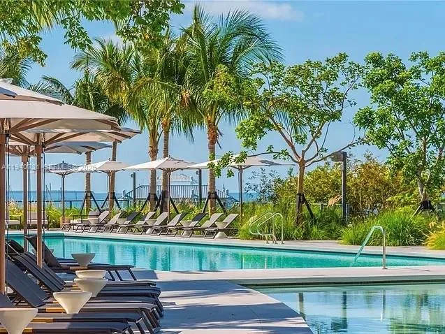 a view of swimming pool with chairs