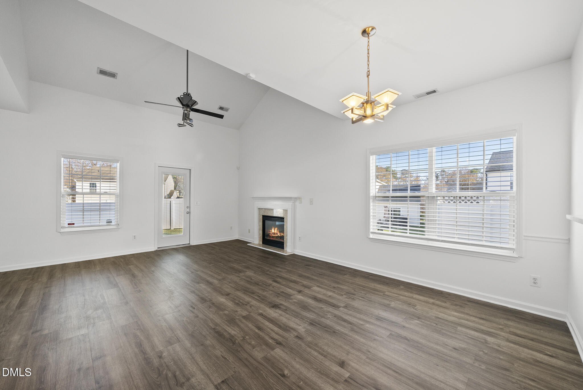 6 Cibola Court Durham, NC 27713 - Photo 12 of 30 a view of an empty room with a window and wooden floor