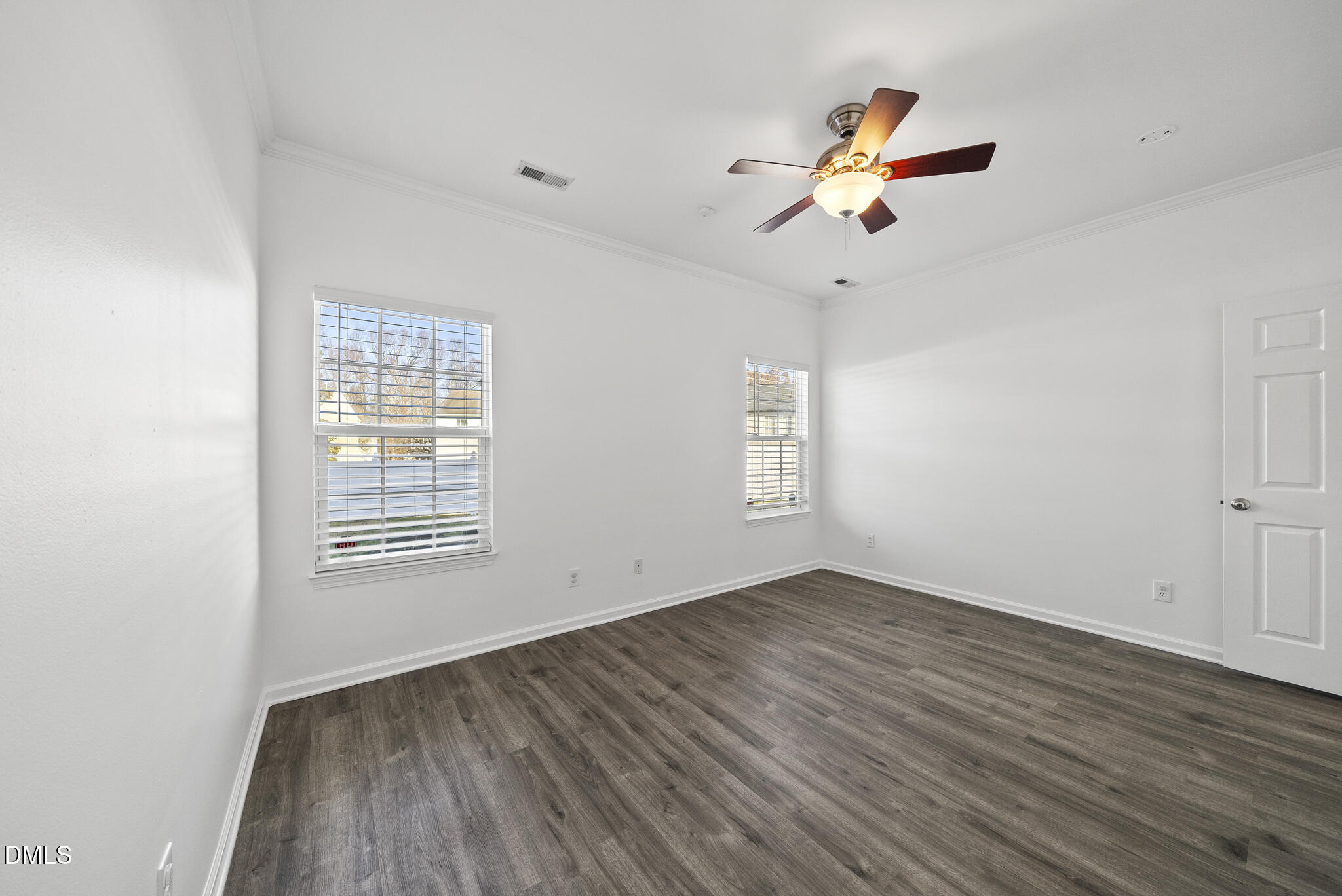 6 Cibola Court Durham, NC 27713 - Photo 15 of 30 an empty room with wooden floor fan and windows