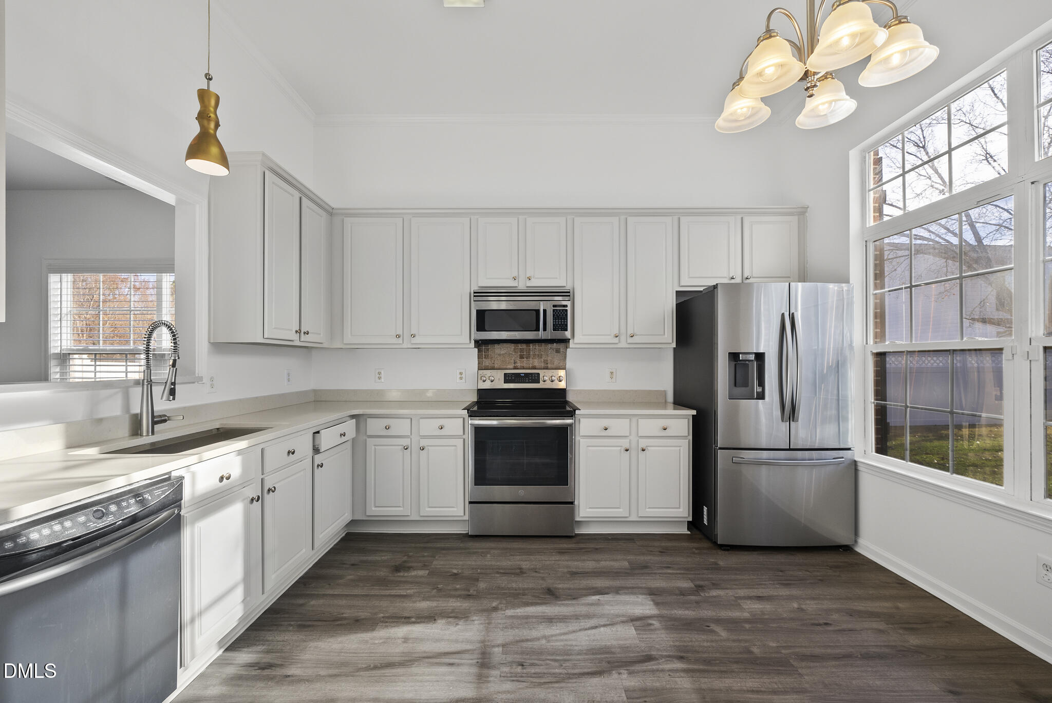 6 Cibola Court Durham, NC 27713 - Photo 4 of 30 a kitchen with a refrigerator and a sink