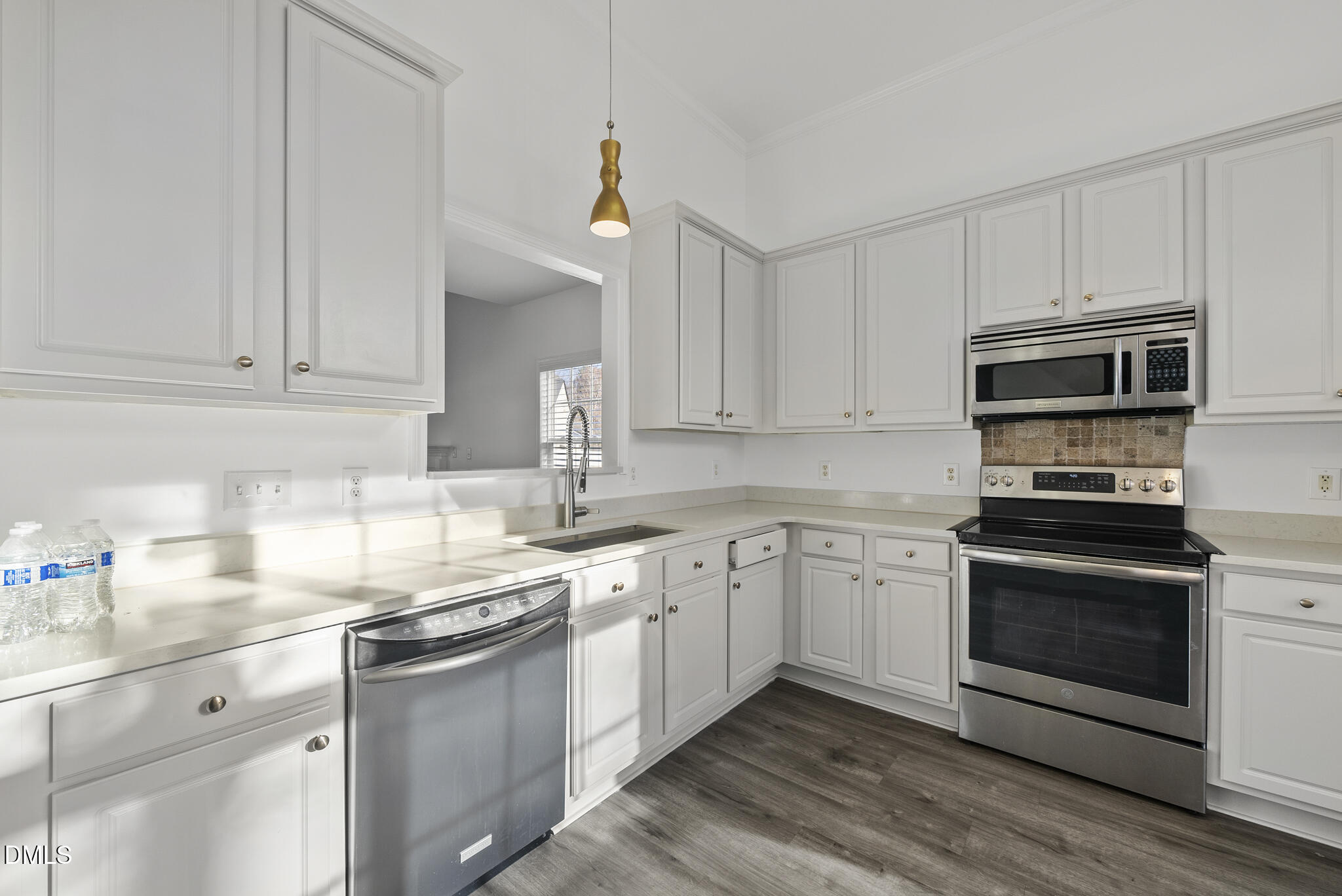 6 Cibola Court Durham, NC 27713 - Photo 5 of 30 a kitchen with stainless steel appliances granite countertop a sink and dishwasher a stove top oven with white countertops