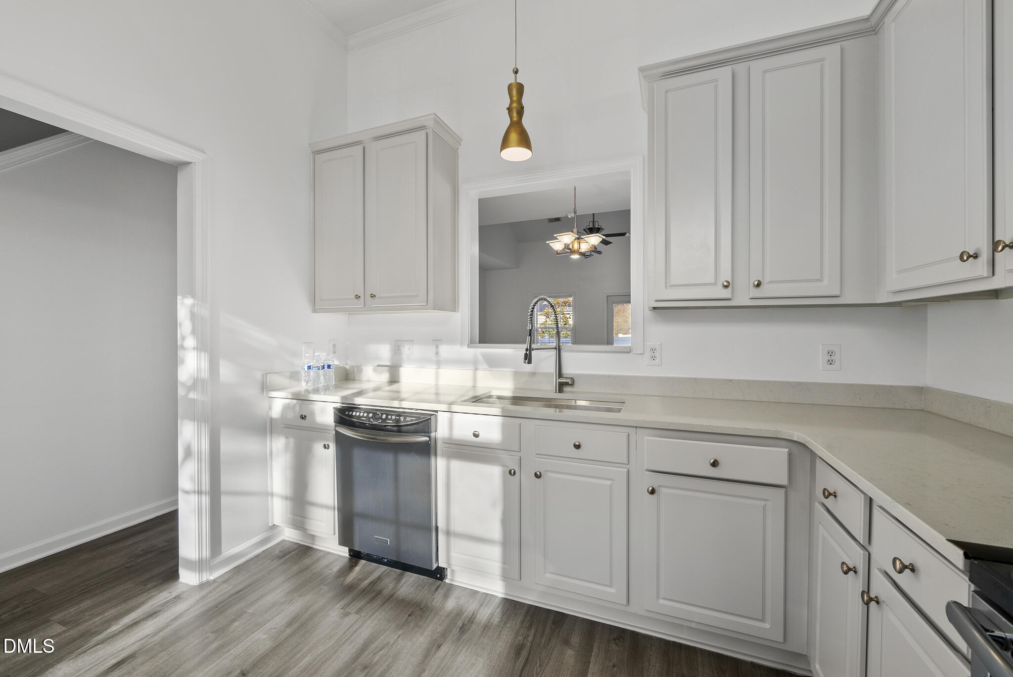 6 Cibola Court Durham, NC 27713 - Photo 7 of 30 a kitchen with white cabinets and sink