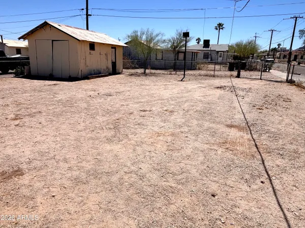 a view of a backyard of the house