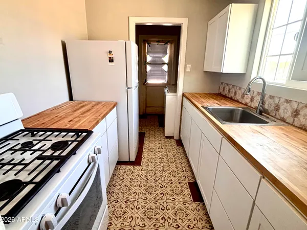 a kitchen with a stove and a sink