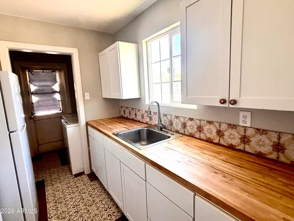 a kitchen with a sink and a window