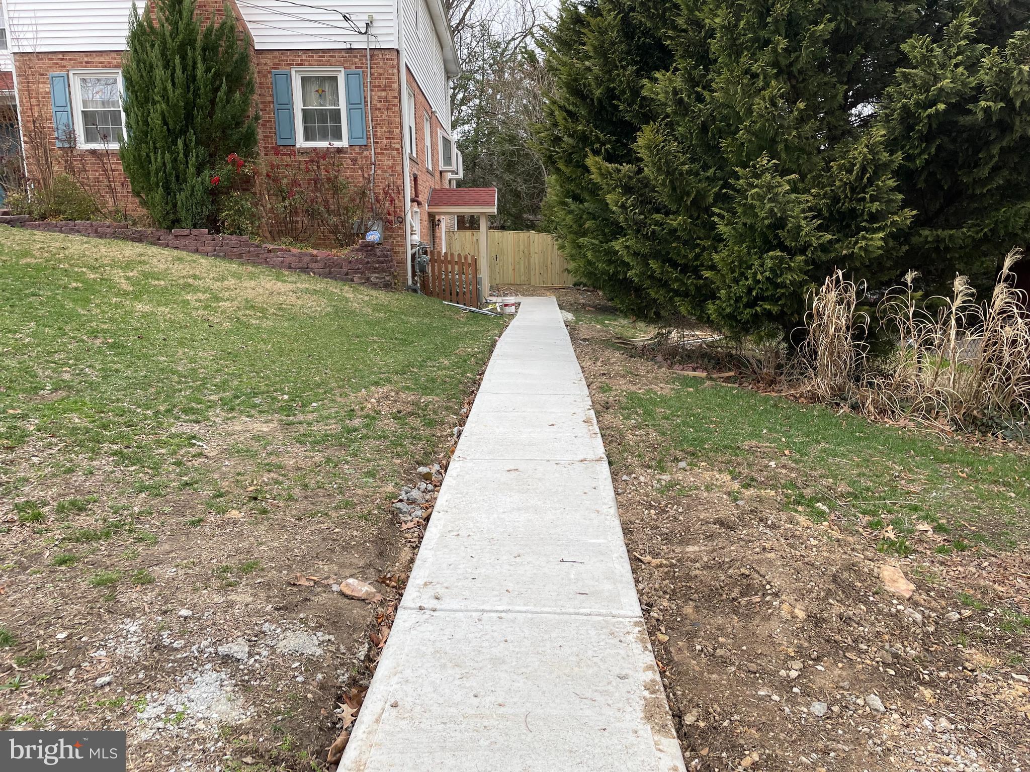 2016 Gatewood Place Silver Spring, MD 20903 - Photo 2 of 24 a pathway of a house with a yard