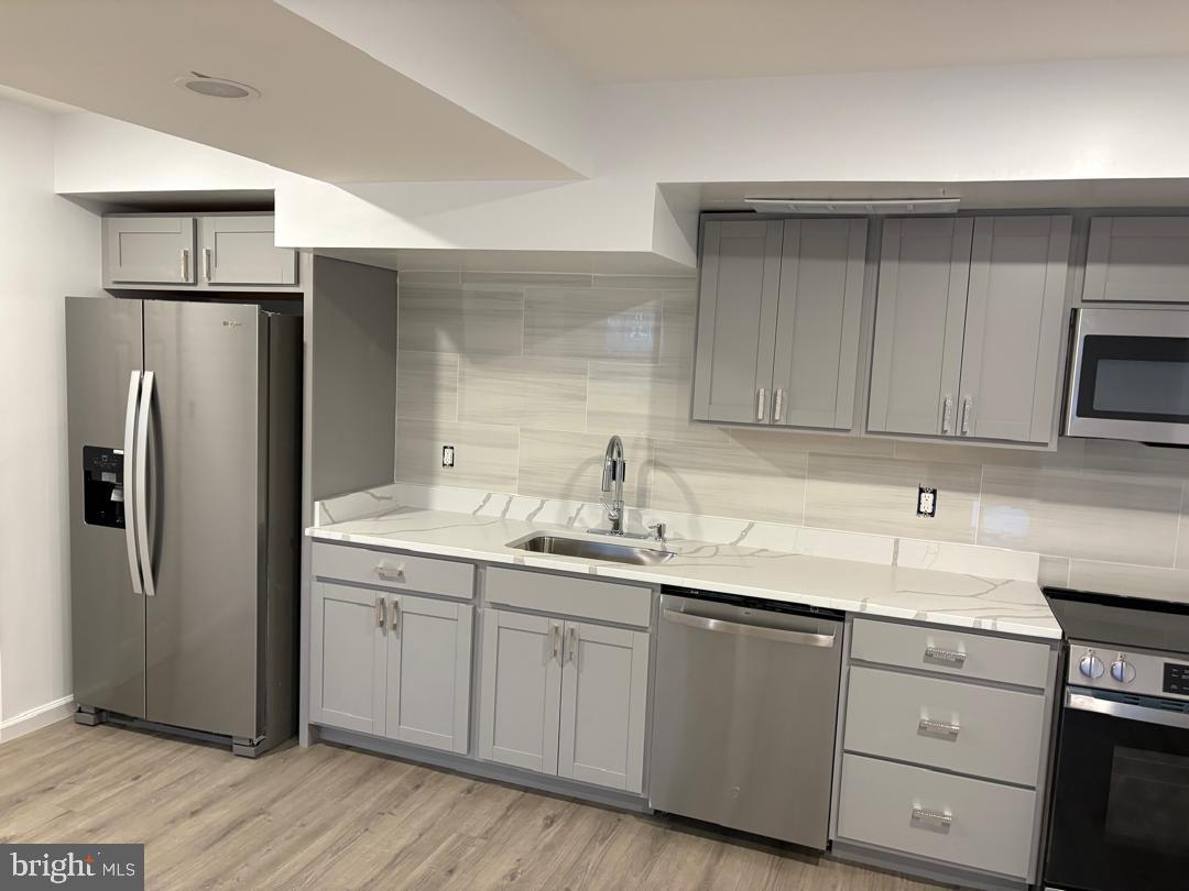 2016 Gatewood Place Silver Spring, MD 20903 - Photo 4 of 24 a kitchen with a sink and refrigerator
