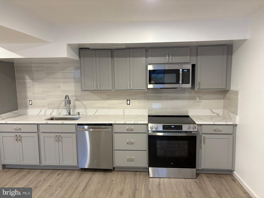 2016 Gatewood Place Silver Spring, MD 20903 - Photo 5 of 24 a kitchen with a sink and steel appliances