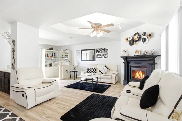 a living room with furniture and a fireplace