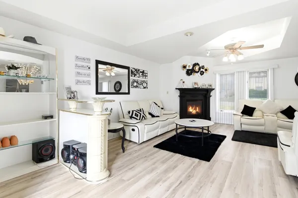 a living room with furniture and a fireplace