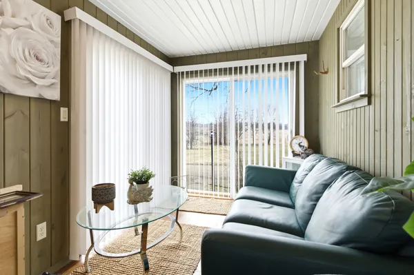 a living room with furniture and a window
