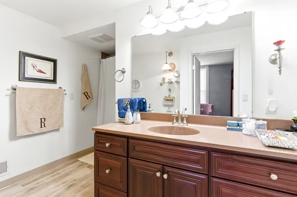 a bathroom with a sink and a mirror