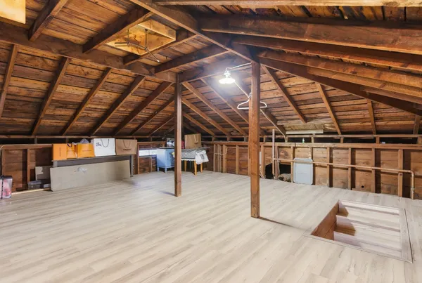 a view of a studio with wooden floor