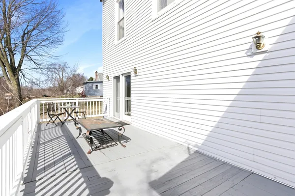 a view of balcony with wooden floor