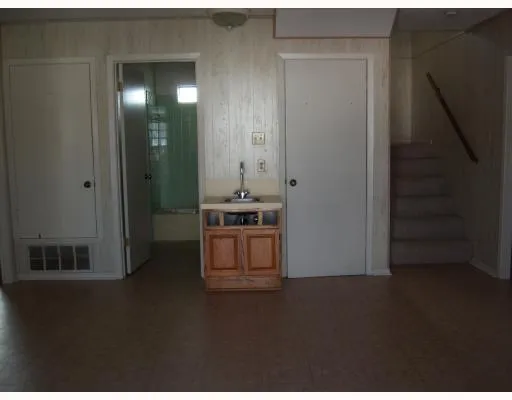 a view of a kitchen from the hallway