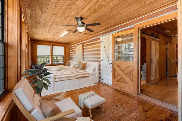 a view of living room kitchen with furniture and floor to ceiling window