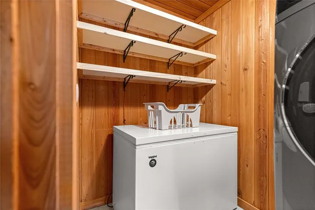 a view of a hallway with washer and dryer