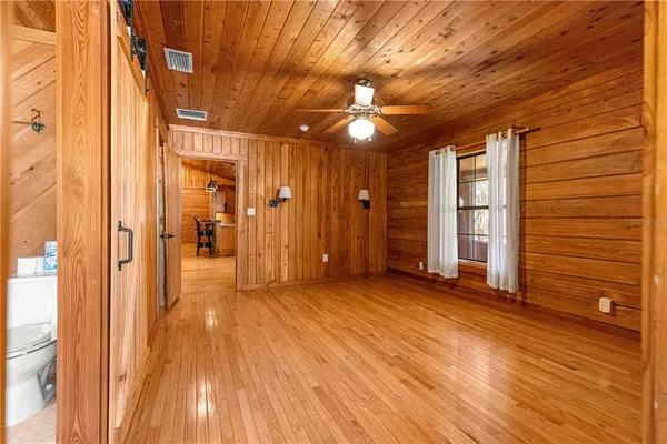 a kitchen with a sink and wooden cabinets