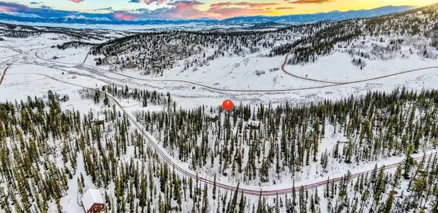 a view of a ocean with a mountain