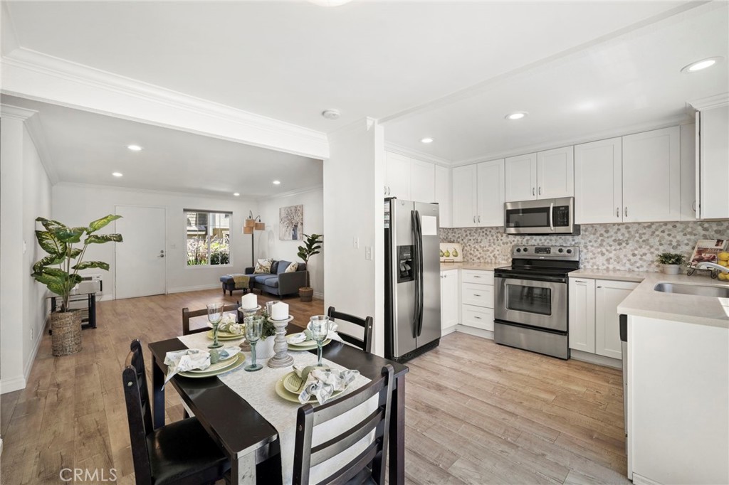 63 Streamwood Irvine, CA 92620 - Photo 10 of 36 The spacious living room flows seamlessly into the dining area