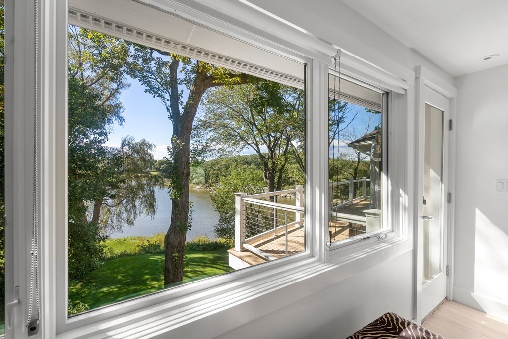 78 Nichols Road Cohasset, MA 02025 - Photo 11 of 23 a view of a house with a large window and wooden floor