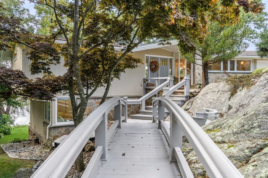 78 Nichols Road Cohasset, MA 02025 - Photo 20 of 23 a view of house with wooden deck and trees